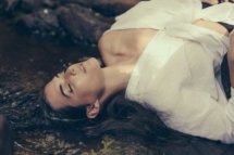 Shannon Berkeley lying in forest