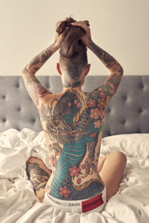 Eva Coombs topless tattoos
