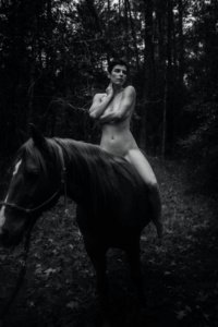 Masha Models on horse covering tits