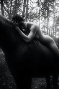 Masha Models lying on horse